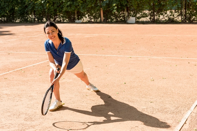 Tennis player with her racket