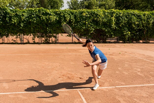 Tennis player with her racket