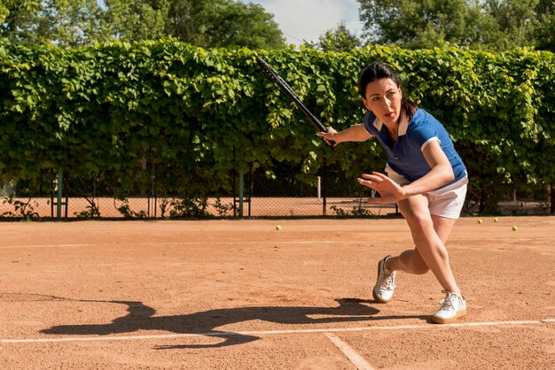 Tennis player with her racket