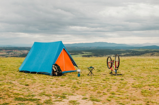 Tent and bike in countryside
