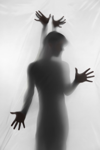 Terrifying hand silhouettes in studio