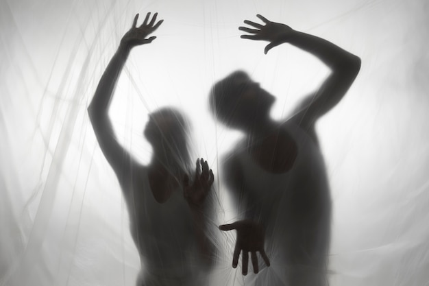Terrifying hand silhouettes in studio