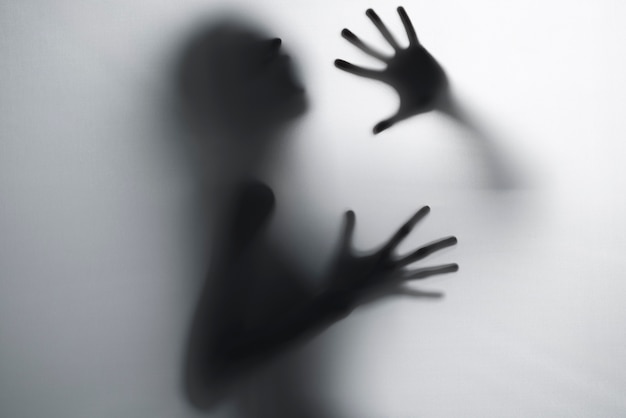 Terrifying hands silhouettes in studio