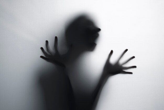 Terrifying hands silhouettes in studio