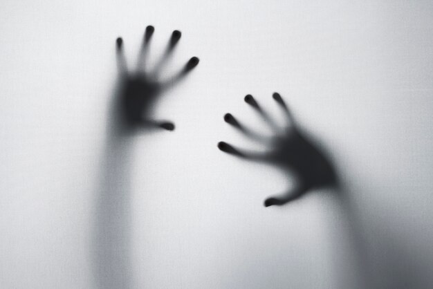 terrifying hands silhouettes in studio