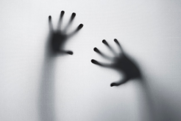 Terrifying hands silhouettes in studio