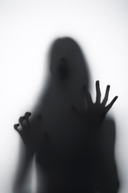 Free photo terrifying hands silhouettes in studio