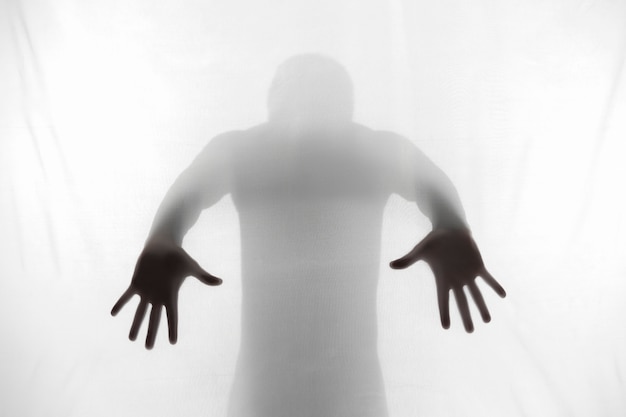 Free photo terrifying hands silhouettes in studio