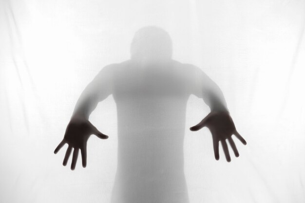 Terrifying hands silhouettes in studio