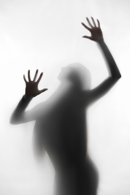 Free photo terrifying hands silhouettes in studio