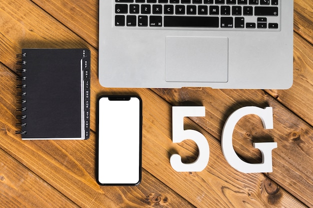 Text 5G and gadgets on table