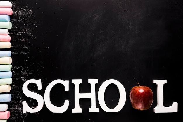 Text School and chalk on blackboard