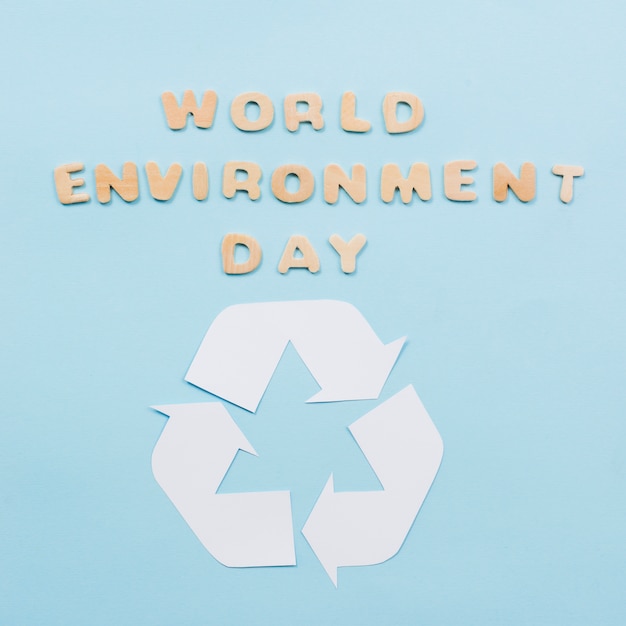 Text world environment day and recycle symbol on blue background