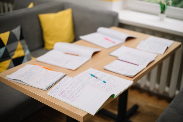 Textbooks on table background