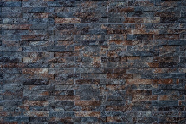 Texture of black with brown brick stone wall