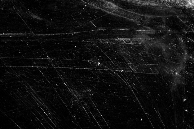 The texture is black with scratches. grunge background