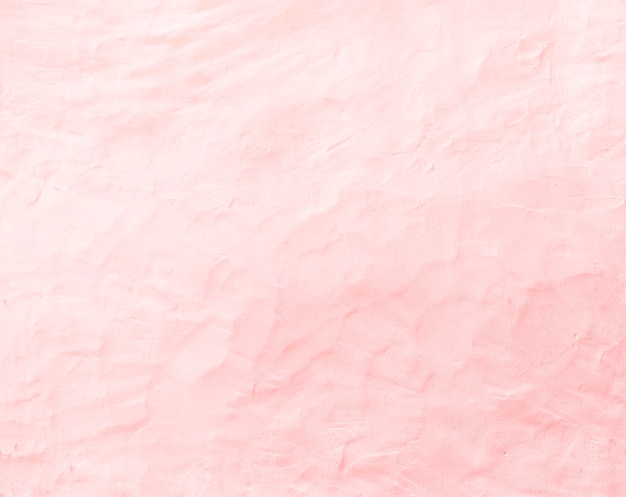 背景のための古いピンクのコンクリートの壁の質感