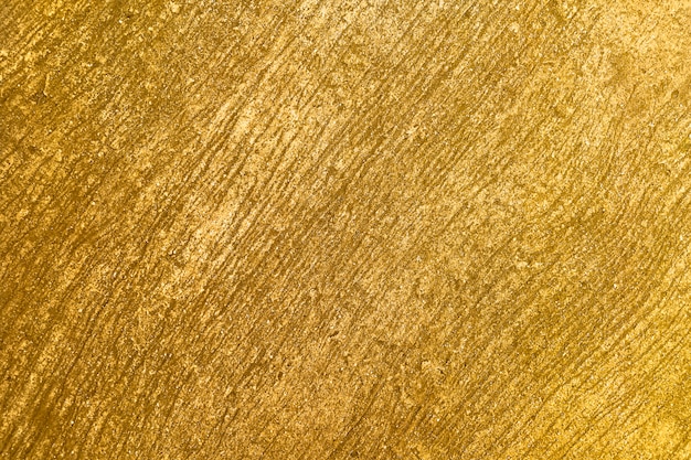 Free photo textured gold background