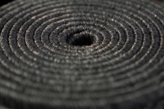 Textured twisted coiled natural dark jute pattern as background