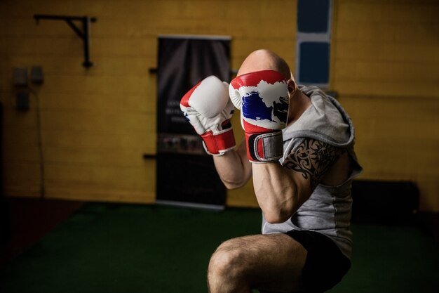 Free photo thai boxer practicing boxing