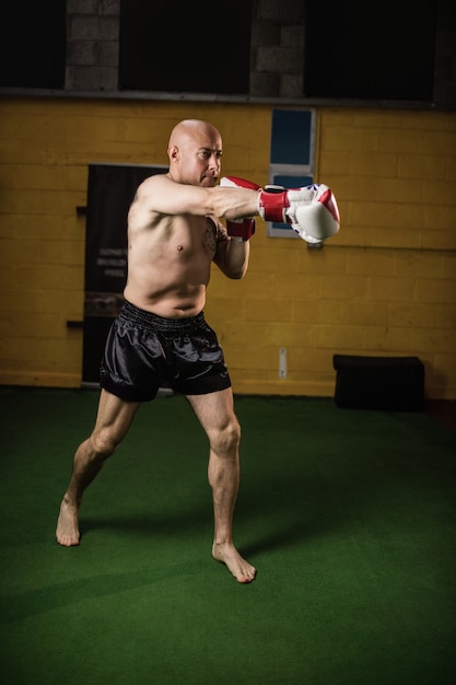 Thai boxer practicing boxing