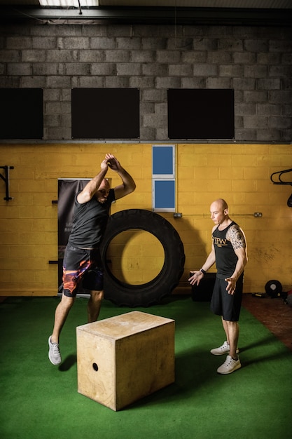 Thai boxers practicing on wooden box