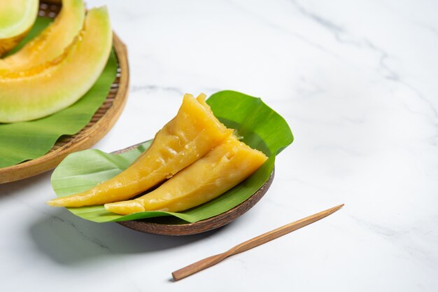 Thai dessert. Cantaloupe steamed pastries put on banana leaf