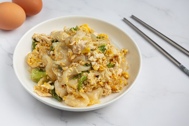 Thai food. Fried noodle with pork in soy sauce and vegetable