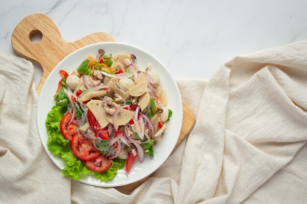 Thai food ;mixed spicy pork sausage salad with vermicelli noodle