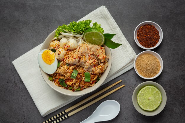 Thai food. noodles spicy boil with pork and boil egg