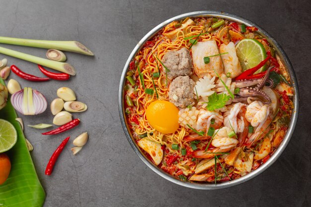 Thai food. noodles spicy boil with seafood and pork in hot pot
