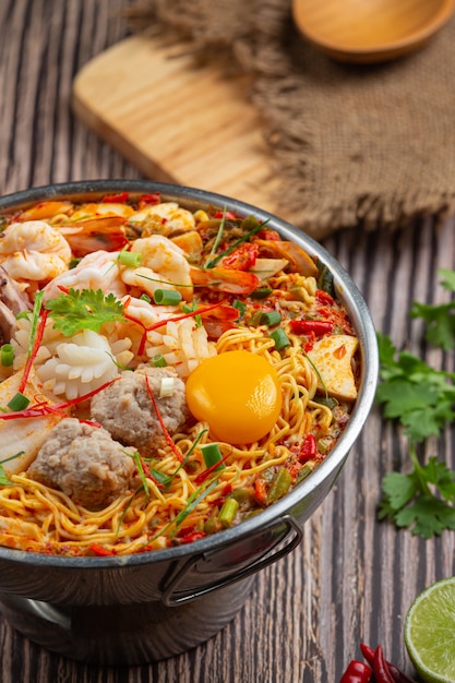 Thai food. noodles spicy boil with seafood and pork in hot pot