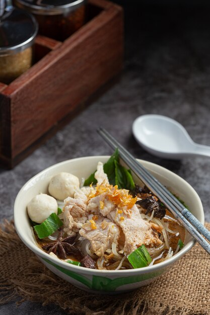 Thai food. Noodles with pork, meatball and vegetable