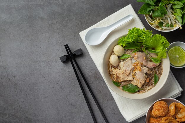 Thai food. Noodles with pork, meatball and vegetable