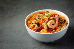 thai food; tom yum kung or river prawn spicy soup