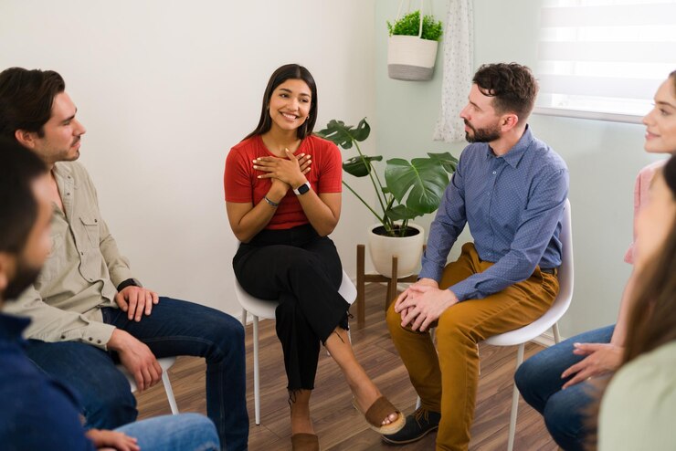 Free Photo thank you for the advice. beautiful happy woman thanking a member of her group therapy for their support and kind words
