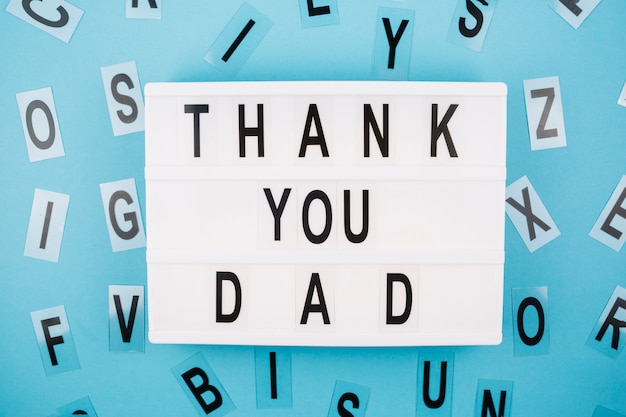 Free photo thank you dad title on tablet near letters