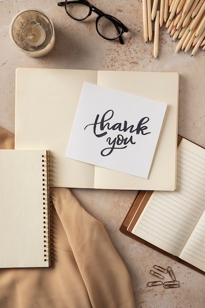 Thank you note and notebook  flat lay