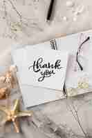 Free photo thank you note and notebook top view