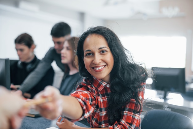 Free photo thank you for that. group of young people in casual clothes working in the modern office