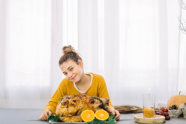 Thanksgiving dishes with happy woman