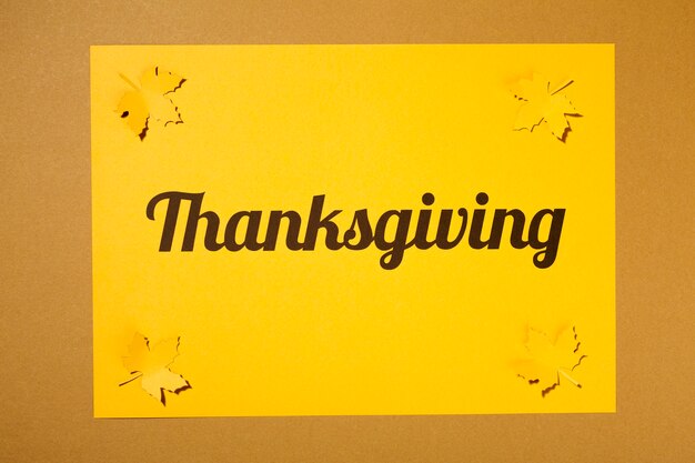 Thanksgiving lettering on brown table