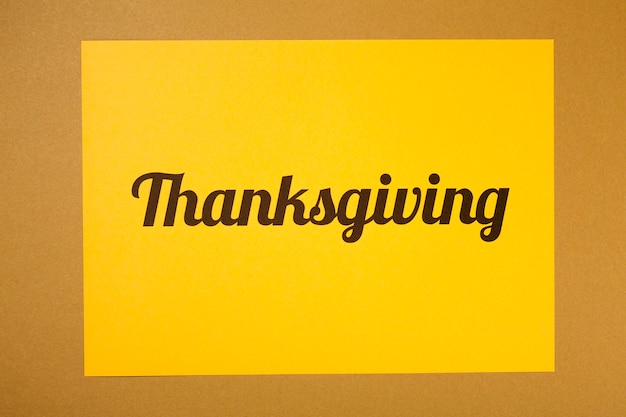 Thanksgiving lettering on yellow paper