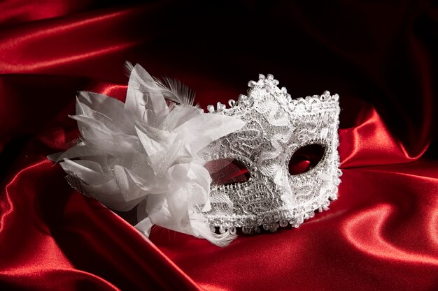 Theater mask on red curtain