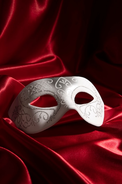 Theater mask on red curtain