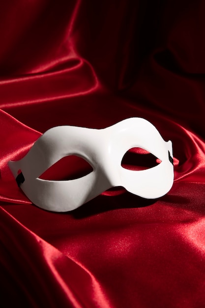 Theater mask on red curtain