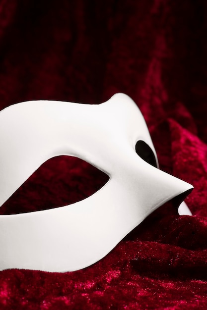 Theater mask on red curtain