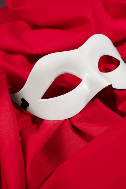 Theater mask on red curtain