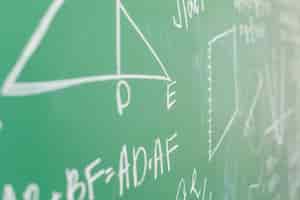 Free photo theorem written in white chalk on school board