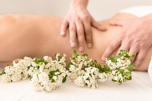 Therapeutic massage with flowers